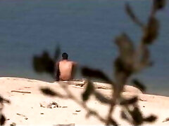 A stranger falls for Jotade's big pink cigar at the naturist beach