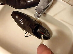 Piss in men's dress shoe
