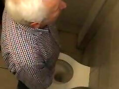 Old Greek man urinate station 