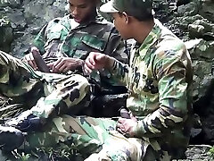 Army fellows scout for rock hard meat outdoors