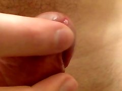 Close up clean-shaven uncut manstick playing with foreskin frenulum