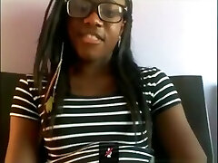 Black bore with glasses masturbates with a hairbrush on her couch on skype