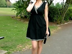 Hot Milf Monica posing in a gorgeous short black dress with matching shiny high heels