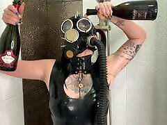Dominatrix Nika in a gas mask pours wine over her trans organzm body. teen lesbian strapin fuck fetish