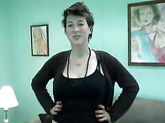 Tall busty brunette strips down and spreads her labia in the living room