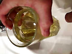 Golden pee in a drinking glass