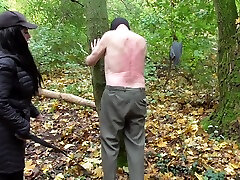 Spank session in the forest, male slave by cuties duck Austria