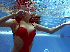 Being naked underwater brings her hardly fored pleasures