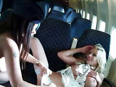 Two flight attendants on a plane play with their dildos in their lesbia spai cam pussies