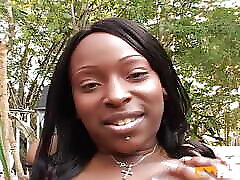 Busty ebony pounds her girlfriend tight pussy with a big strapon outdoor