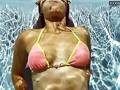 French model enjoys herself underwater