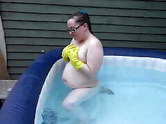 Naked rubber gloves fetish in the hot tub