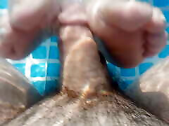 Underwater foot job in the back yard pool