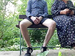 Cheerful milf jerks off strangers and takes photos on the street