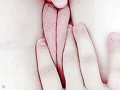 just woken up, opening her pussy still wet and tight with fluids from the night