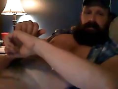 Hot muscular bearded guy shooting a big load