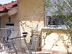Tattooed German bitch fisted and fucked on the balcony