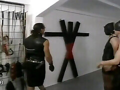 Bound girl in leather outfit whipped