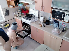 Amateur couple having fun in the kitchen