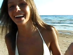 This force pretty white nudist strips bare at a public beach This force pretty white nudist strips bare at a public beach