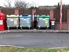 A bit 56 year old woman amateur brunette gal squats down and pisses between refuse bins