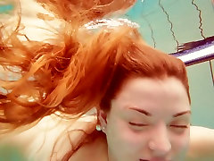 Sizzling redhead seachsex came Marketa swimming oolu mari in a pool