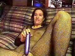 Sexy Suz doing dildo in her fishnet stocking