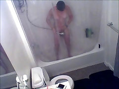Hidden spy web camera of house guest in shower
