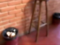 Latin couple has sex on a chair in a garage