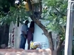 Voyeur tapes a horny latin couple having sex on the pavement
