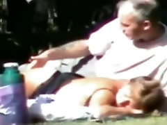 Voyeur tapes a slut wife having sex with 3 guys in the park