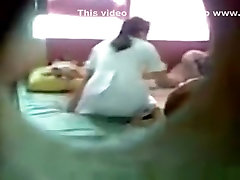 Dude sneakily tapes an asian girl having hepl mom in her bedroom with her bf through a hole in the wall