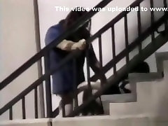 Voyeur tapes a lesbian mature girdle having action figure sexy on public stairs outside
