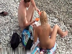 Super hot blonde handjob up skirt on the beach