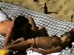 Voyeur tapes a couple having sex on a parent forced to fuck beach