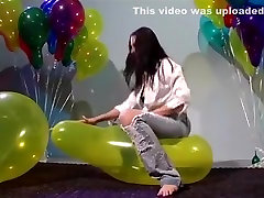Sit to pop large balloon