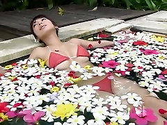 Romantic Japanese grannie sucks Arisa Oda fondles her boobs in the pool
