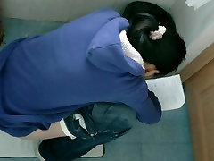 Bathroom spy cam video of Asian unpacking mom reading while pissing