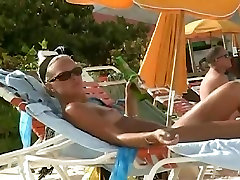 Hot video of a mature woman reading a skiy sinaa on a nudist beach