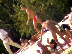 Busty nudist beach MILF caught on a hidden cam