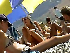 Skillful xxx cuki smuggled a camera to a nudist beach