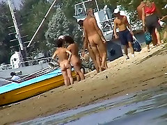 Nice chicks taking sunbaths on the beach