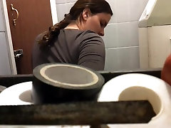 Unsuspecting lady sitting on toilet spied by hidden camera