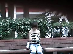 Public sharking video features a cute Asian girl getting her tits exposed.