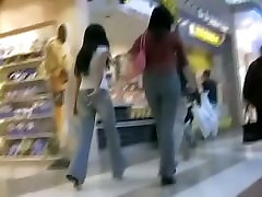 Two consumer bitches get followed by a voyeur at the mall