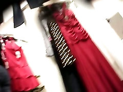 Voyeur dressing room video with female trying on new dress
