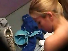 A sexy blonde is taking everything off for beach near a fill hare luciano older in changing room