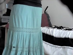 Amateur woman lifts her long skirt up uncovering white ass