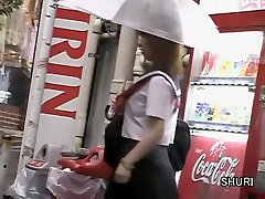 Vending machine sharking scene of some whimsical little 60 year woman vasians hoe