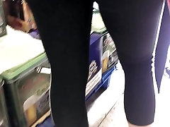 skinny blonde milf in adidas leggings in german supermarket